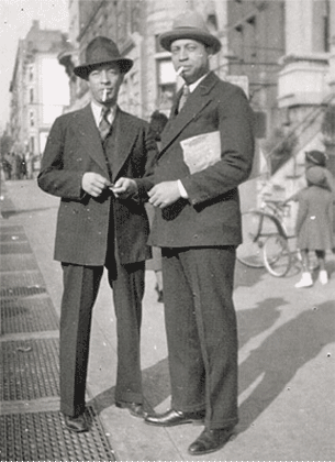 J.C. (left) on the street, 1930s
